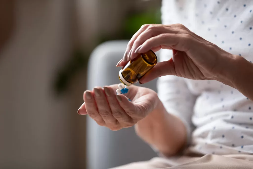 Various-medications-can-cause-night-sweats-as-a-side-effect-scaled A person taking a medication that could cause night sweats as a side effect