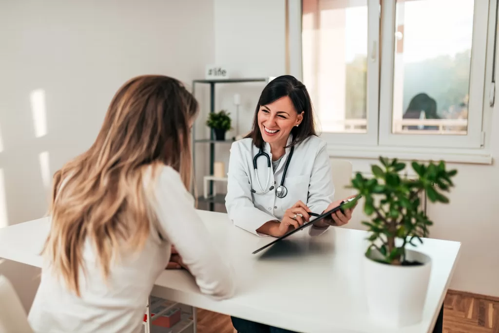 Female doctor explaining diagnosis to her patient Female doctor explaining diagnosis to her patient